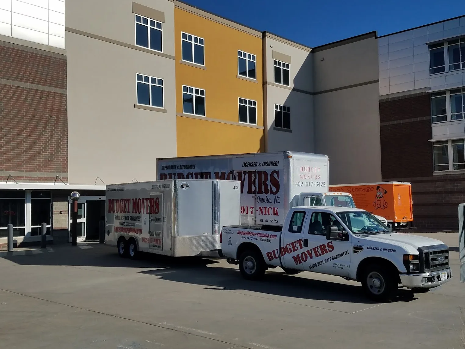 Budget Movers truck and crew at an Omaha home